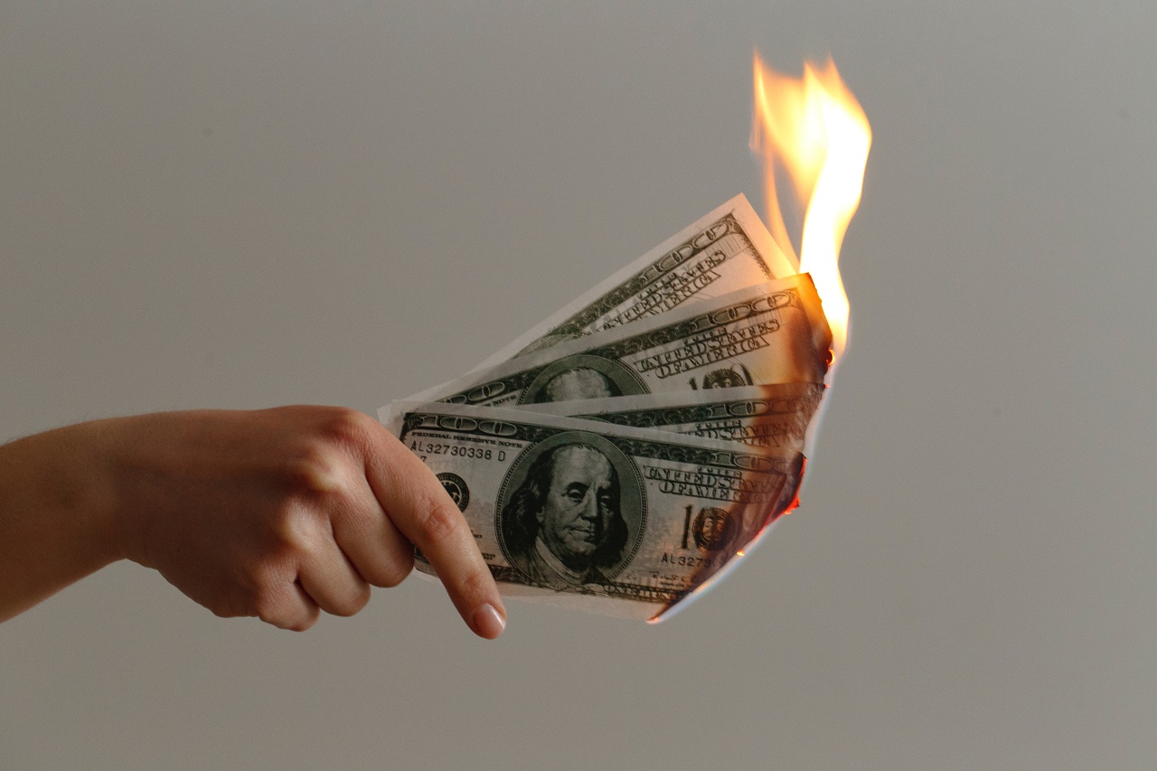money burning waste money