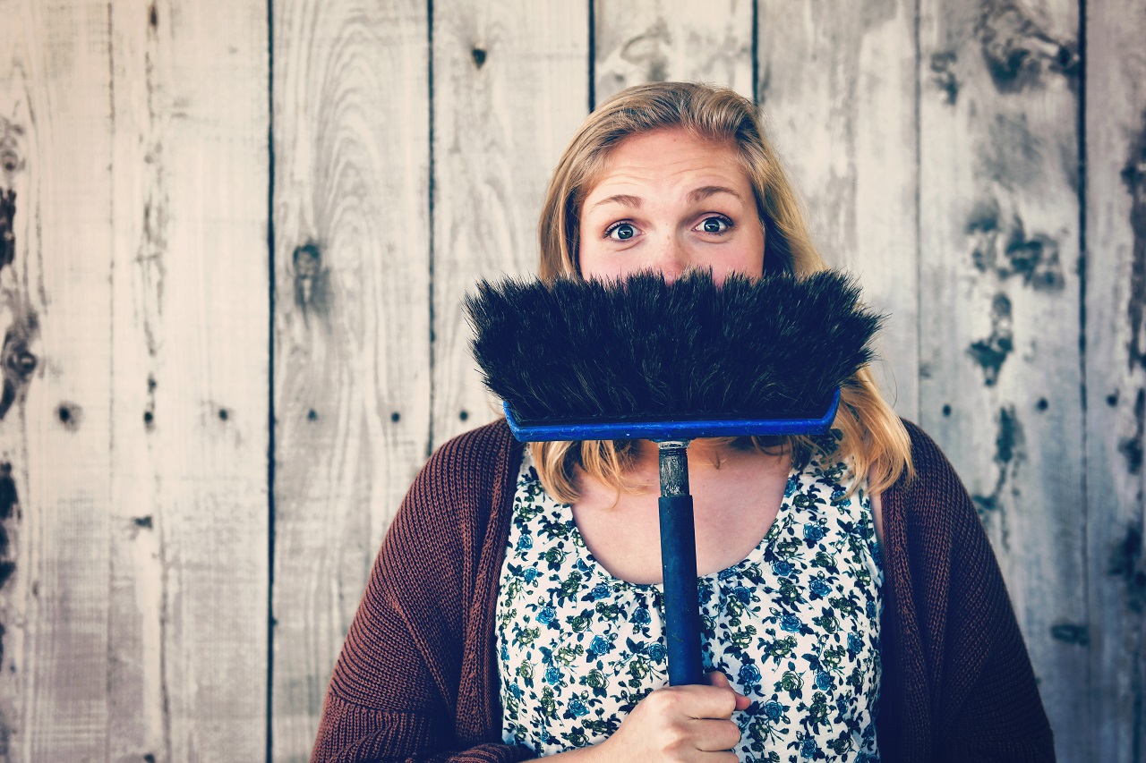 lady behind broom