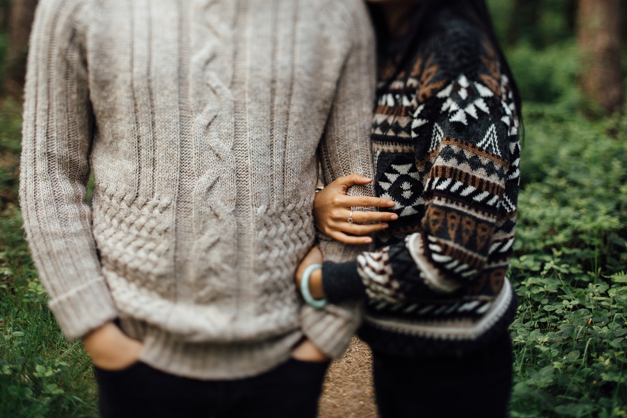 two people wearing sweaters
