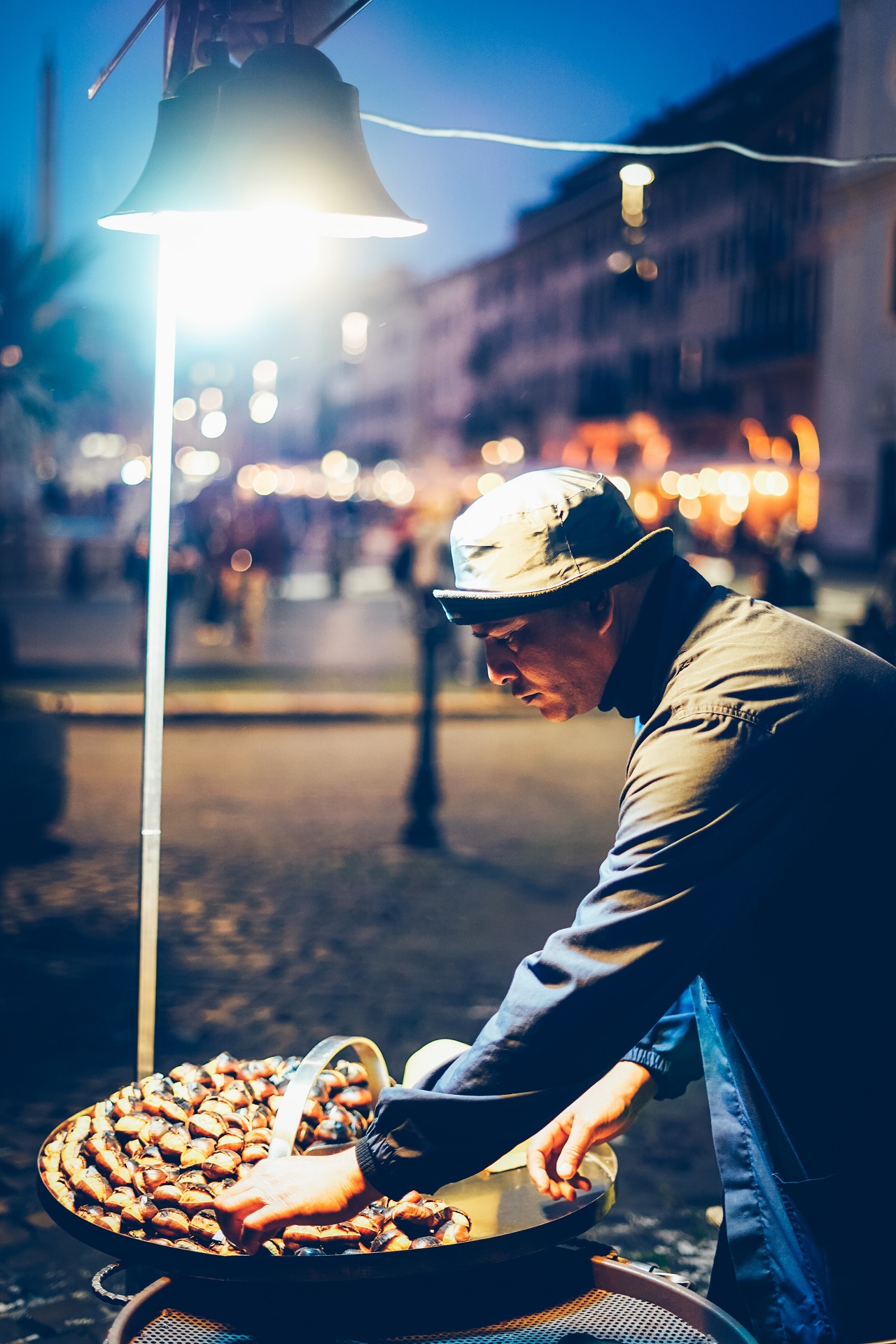 man roasting chestnuts