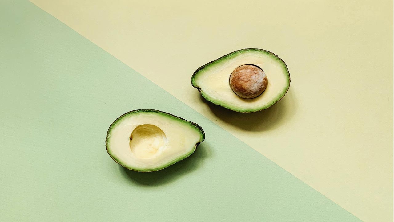 a avocado with yellow and green background