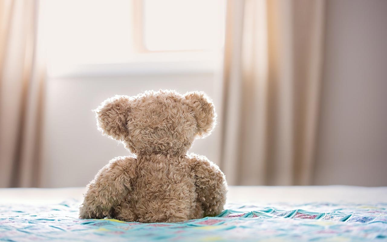 teddy bear on bed