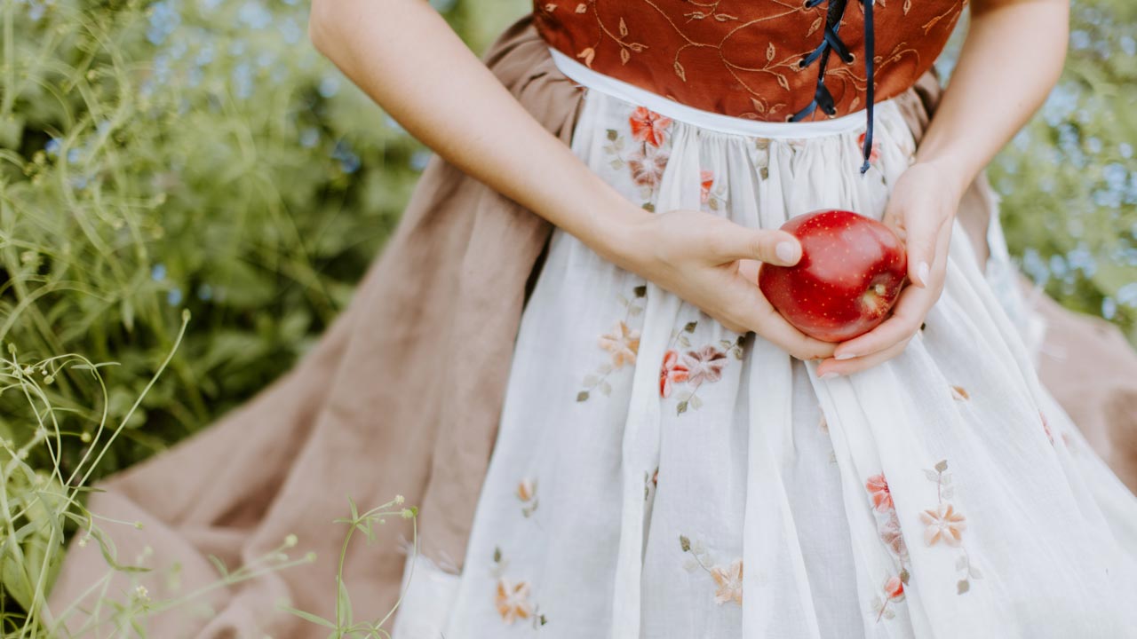 women holding an apple