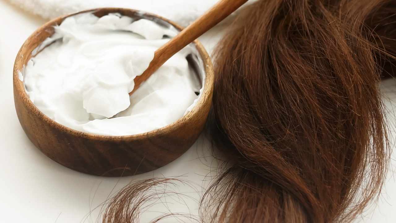 Coconut oil renowned for its moisturizing qualities, can be applied directly to hair to make it softer.