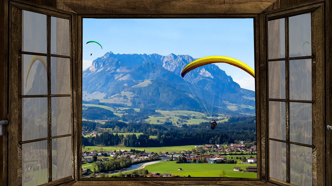 opened window with the view of mountains and natural surroundings