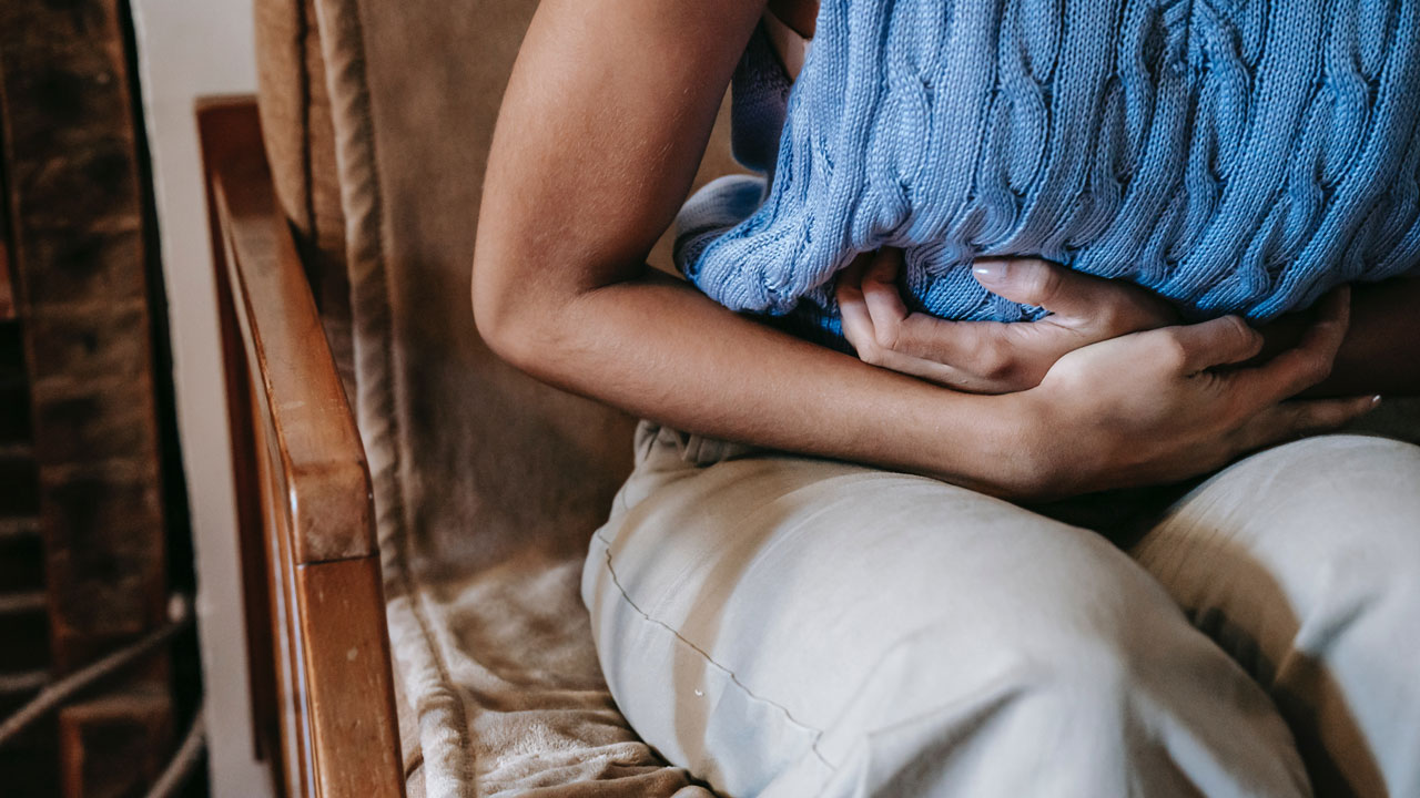 a person suffering from stomach pain