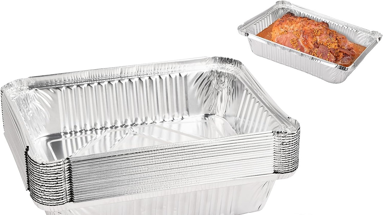 displaying clean aluminum trays with food in it