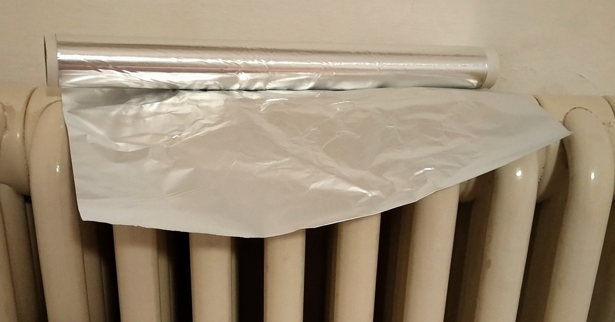 Posing some layers of tin foil between your radiator and the wall can limit heat loss to the outside.