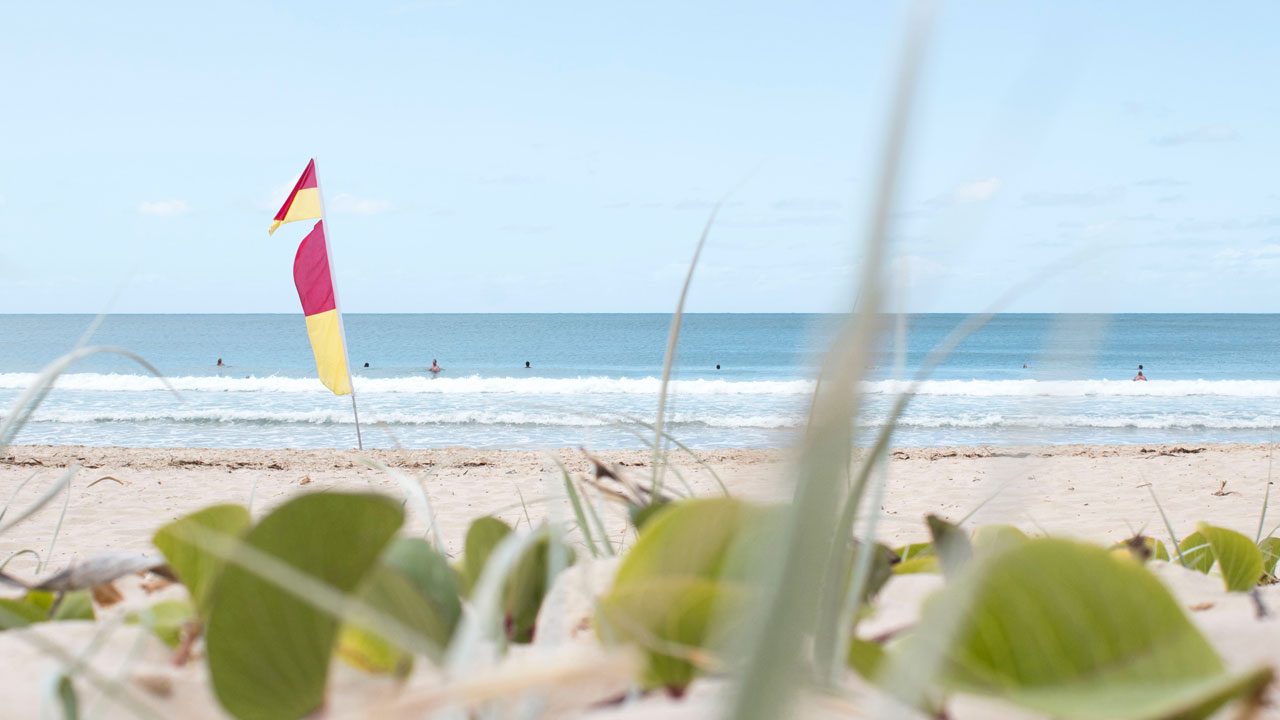 In some regions, the sign of an absent lifeguard is represented by a red and yellow flag.