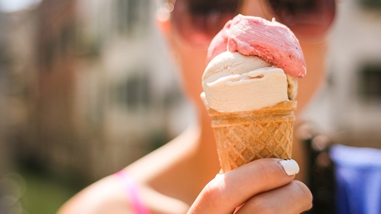 a women has a ice cream cone in her hand