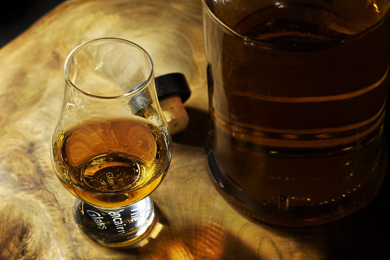 a bottle of rum and some poured in a glass