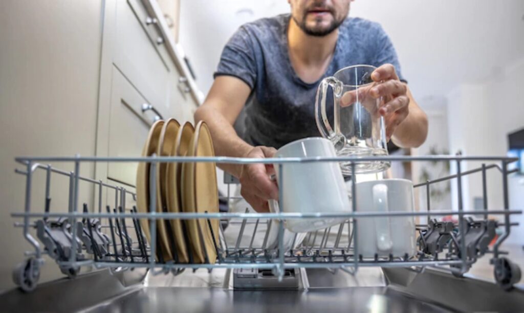 It's better to remove large food residues with a sponge or cloth before loading dishes into the dishwasher