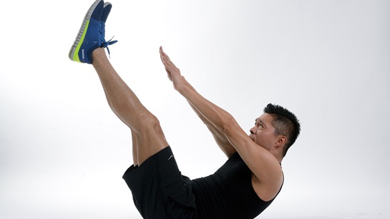 a man is doing roll-up exercise