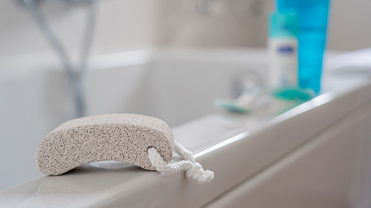 remove the dead skin with a pumice stone