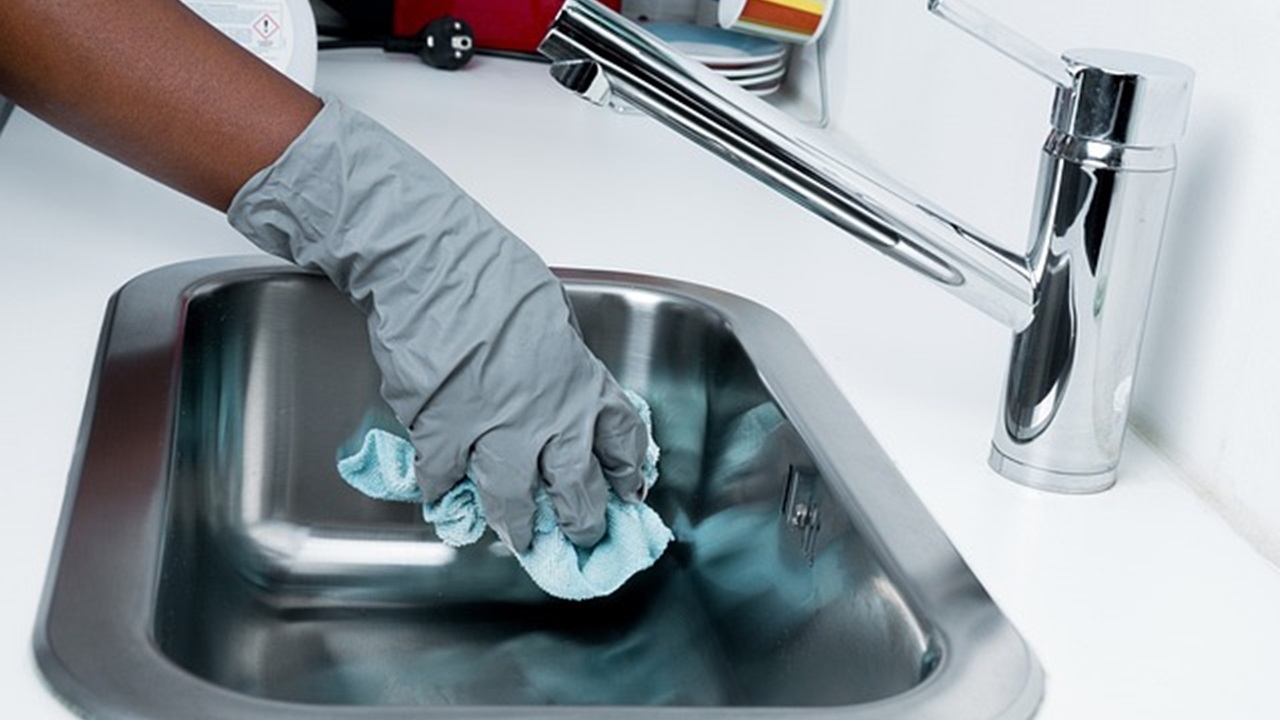 a person is cleaning the basin