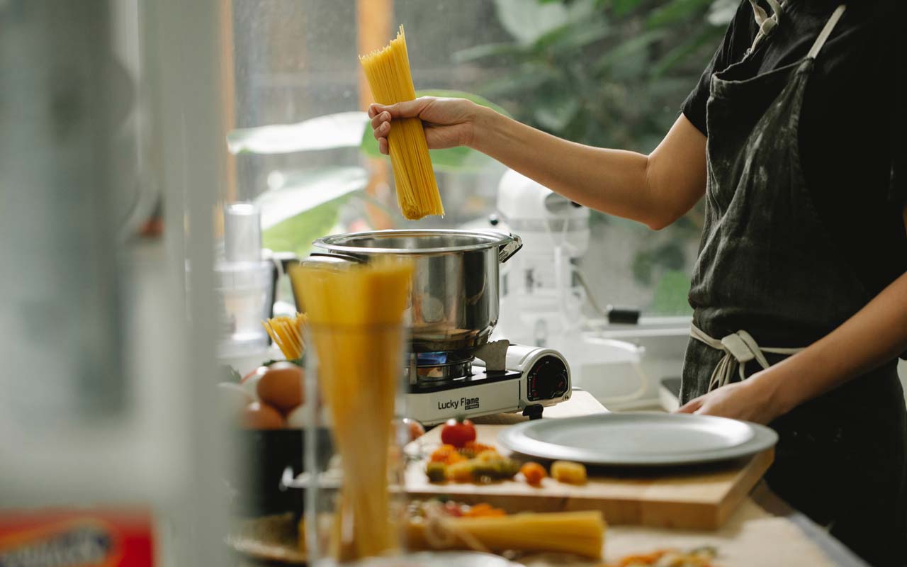 Making spaghetti in the kitchen