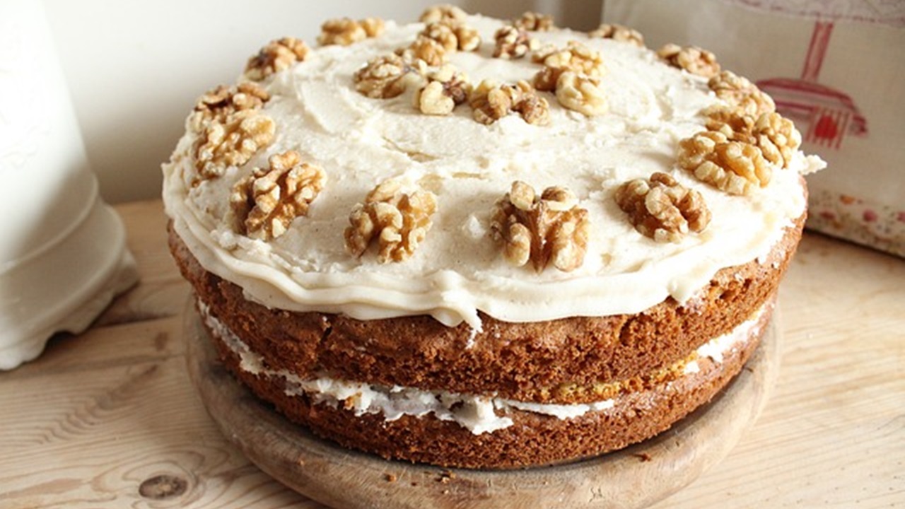 a delicious walnut cake placed on the wooden table