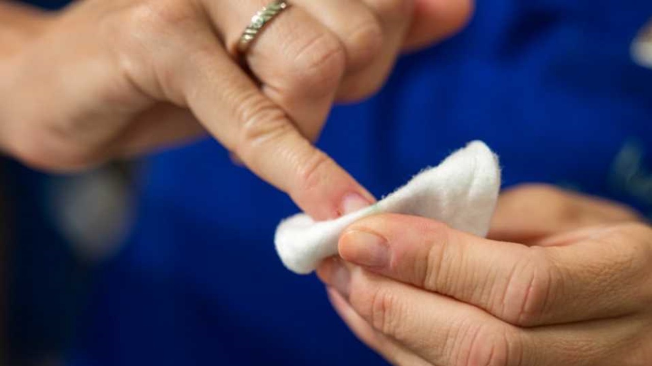 a women is cleaning her nails