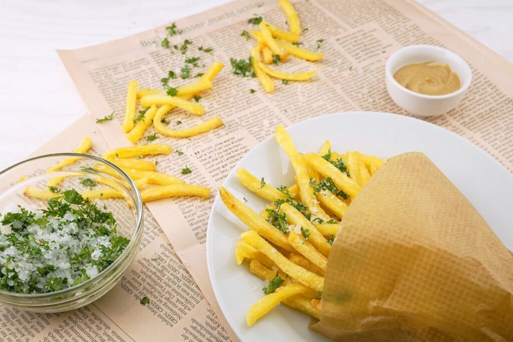 fried chips in a plate placed on the table