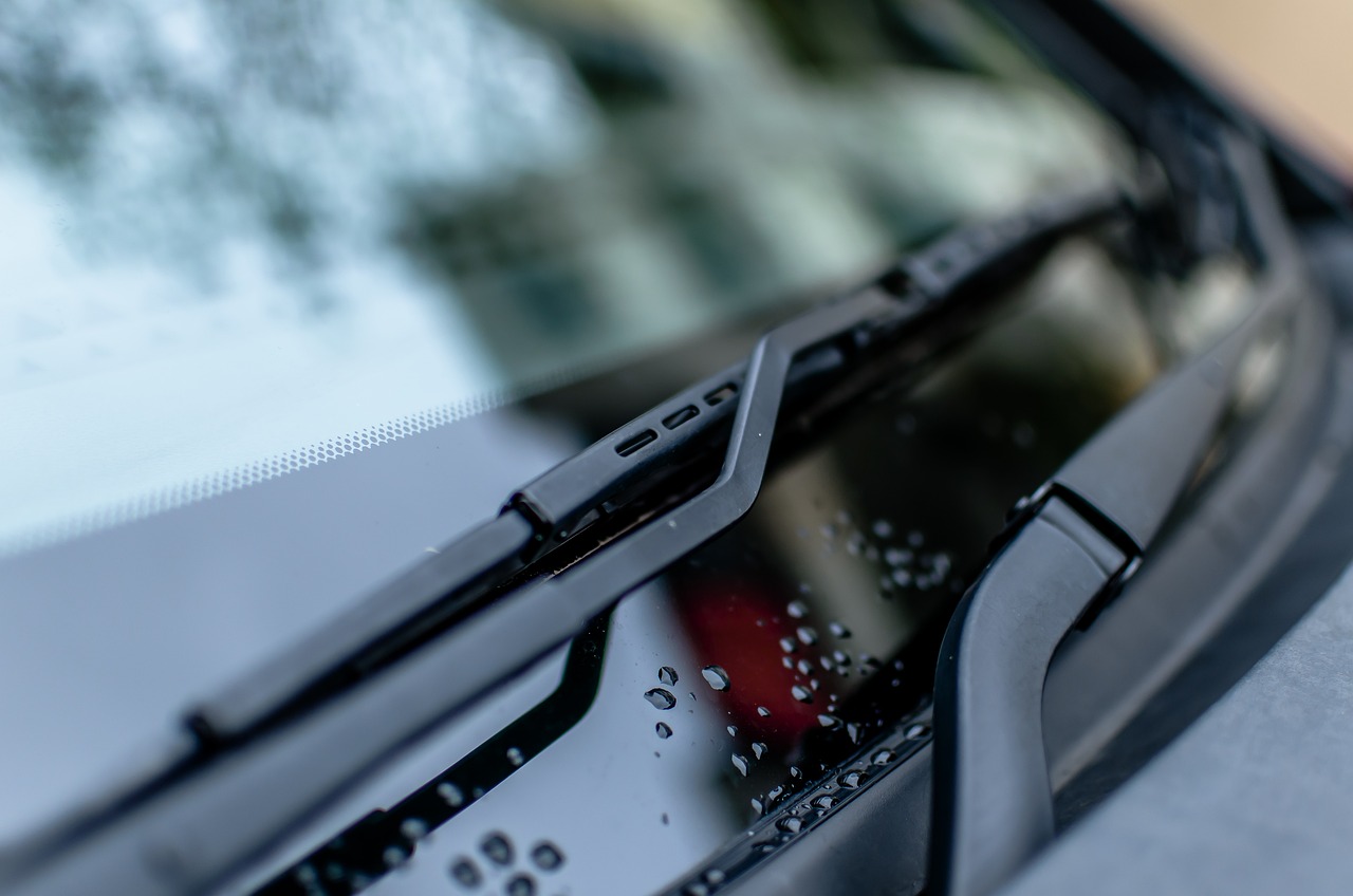 some drops of water are on the windshield of the car