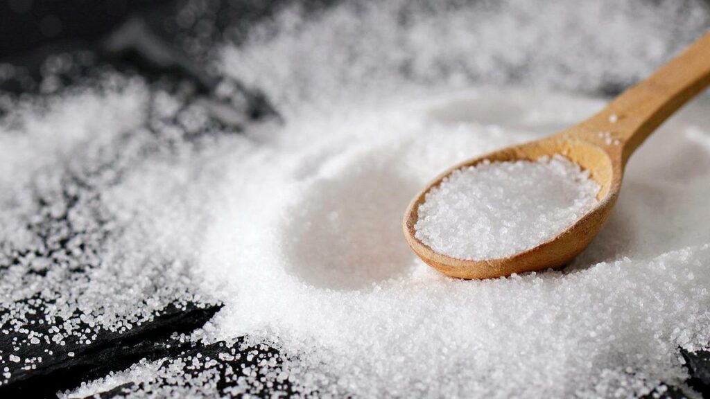 salt is placed on a cloth and some in a spoon