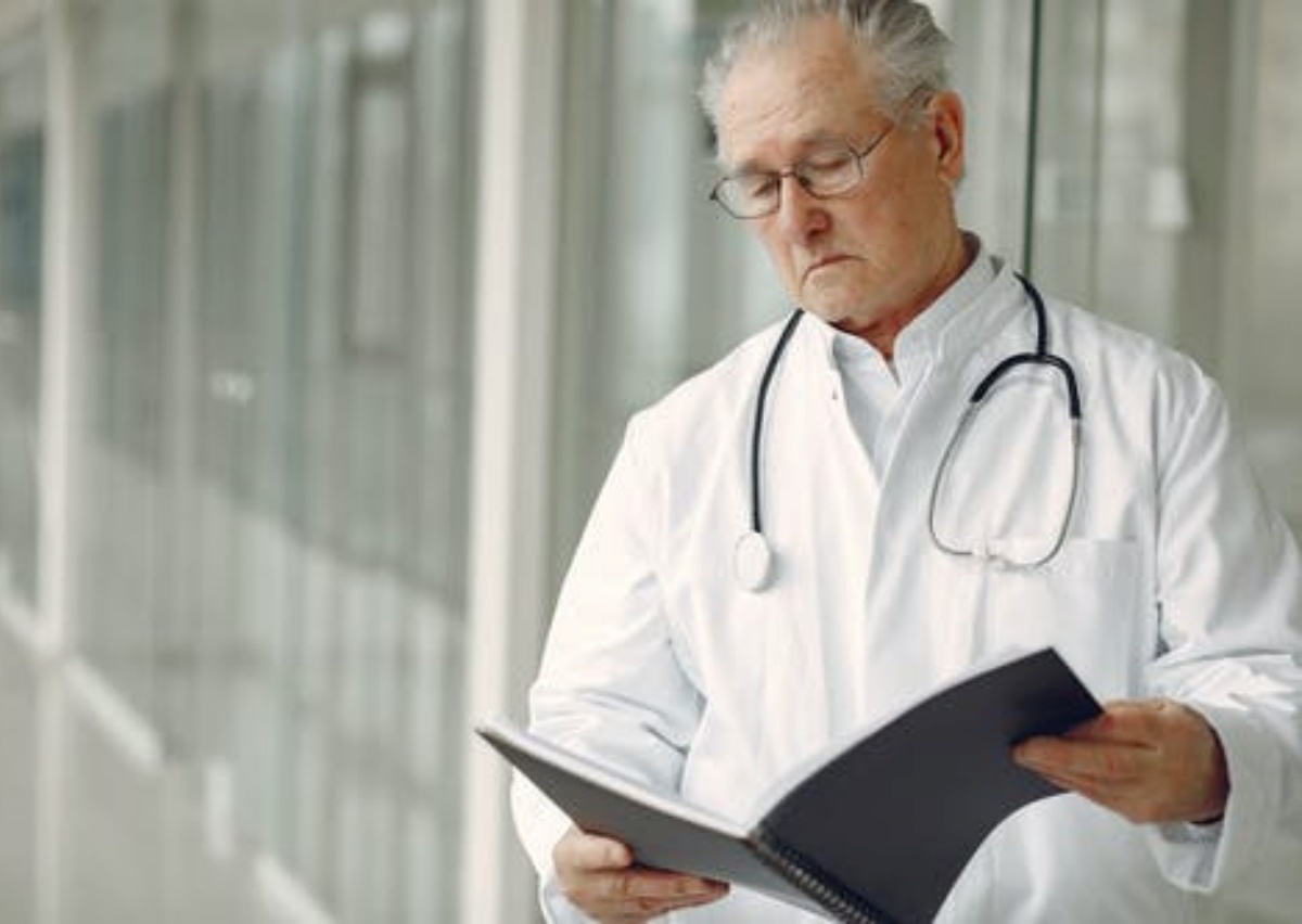 a doctor is checking a file of the patient