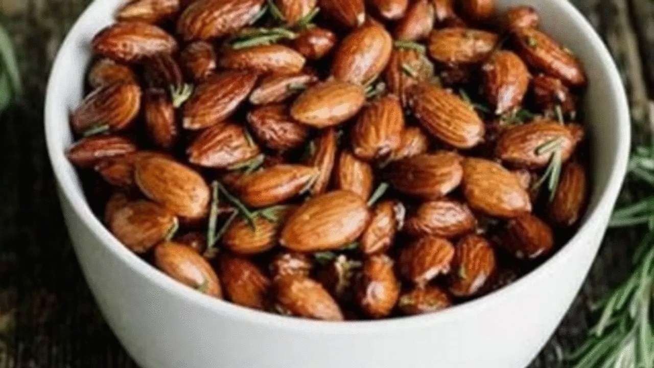 Almonds and rosemary in a bowl
