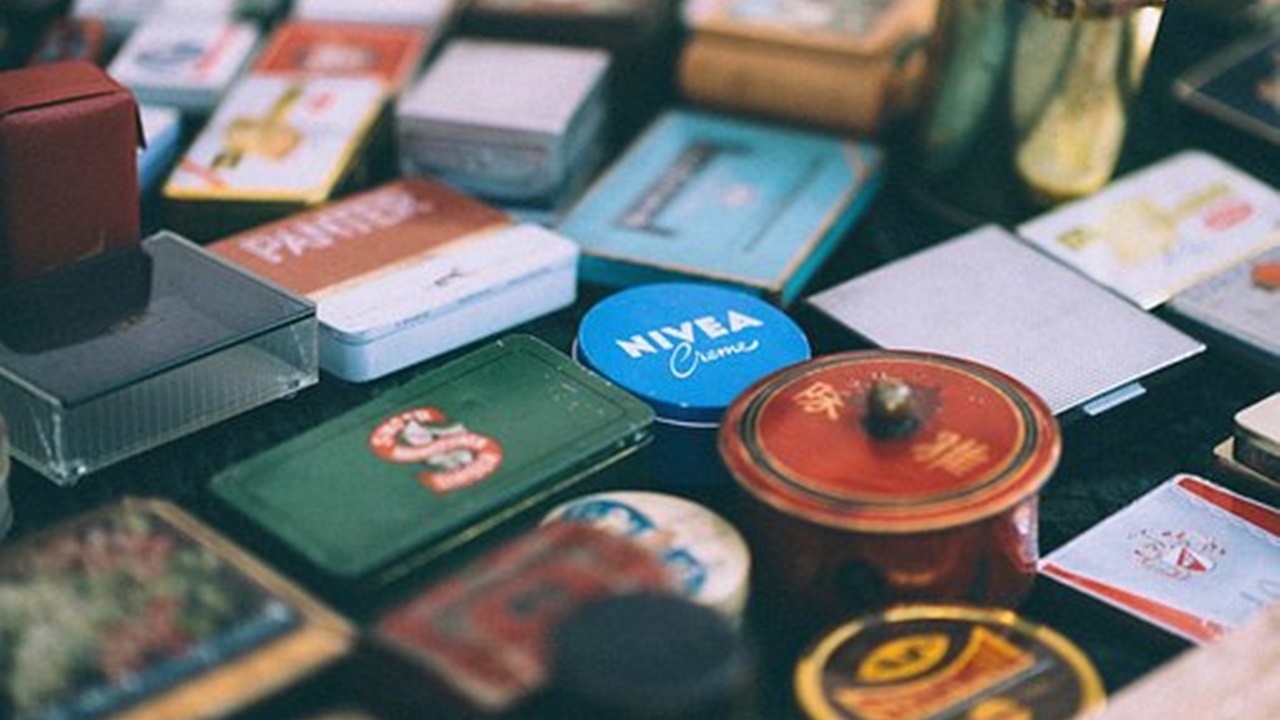 a box of nivea cream with other items placed on the table