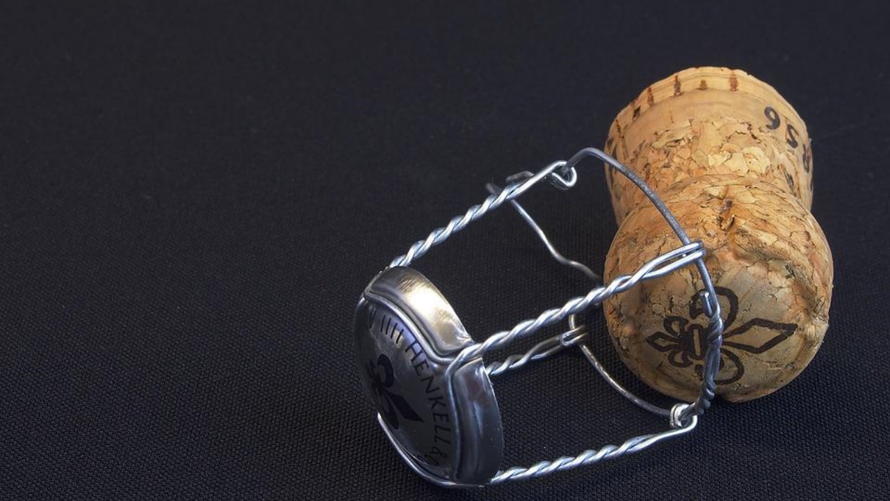 a cork is released from its steel cap