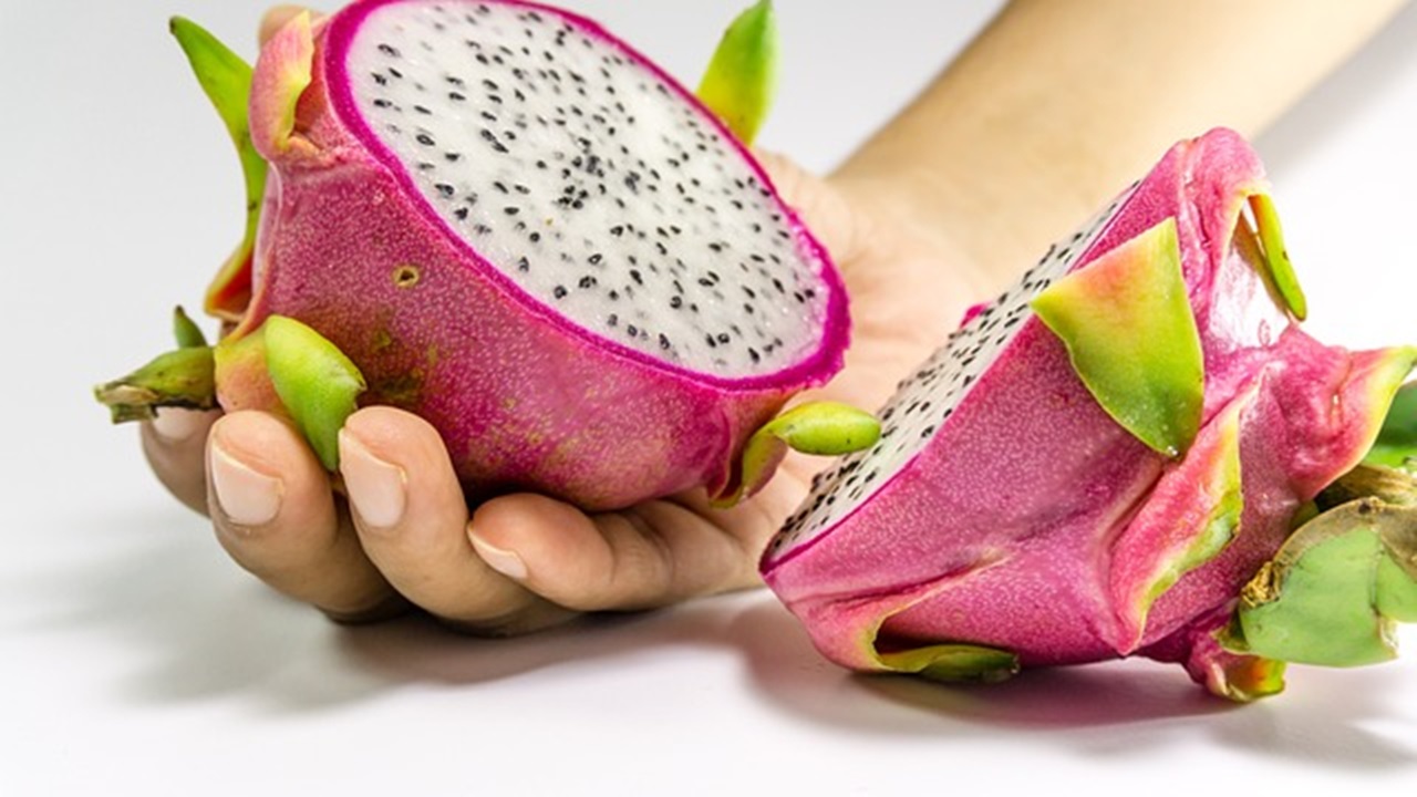 a sliced dragon fruit placed on the table