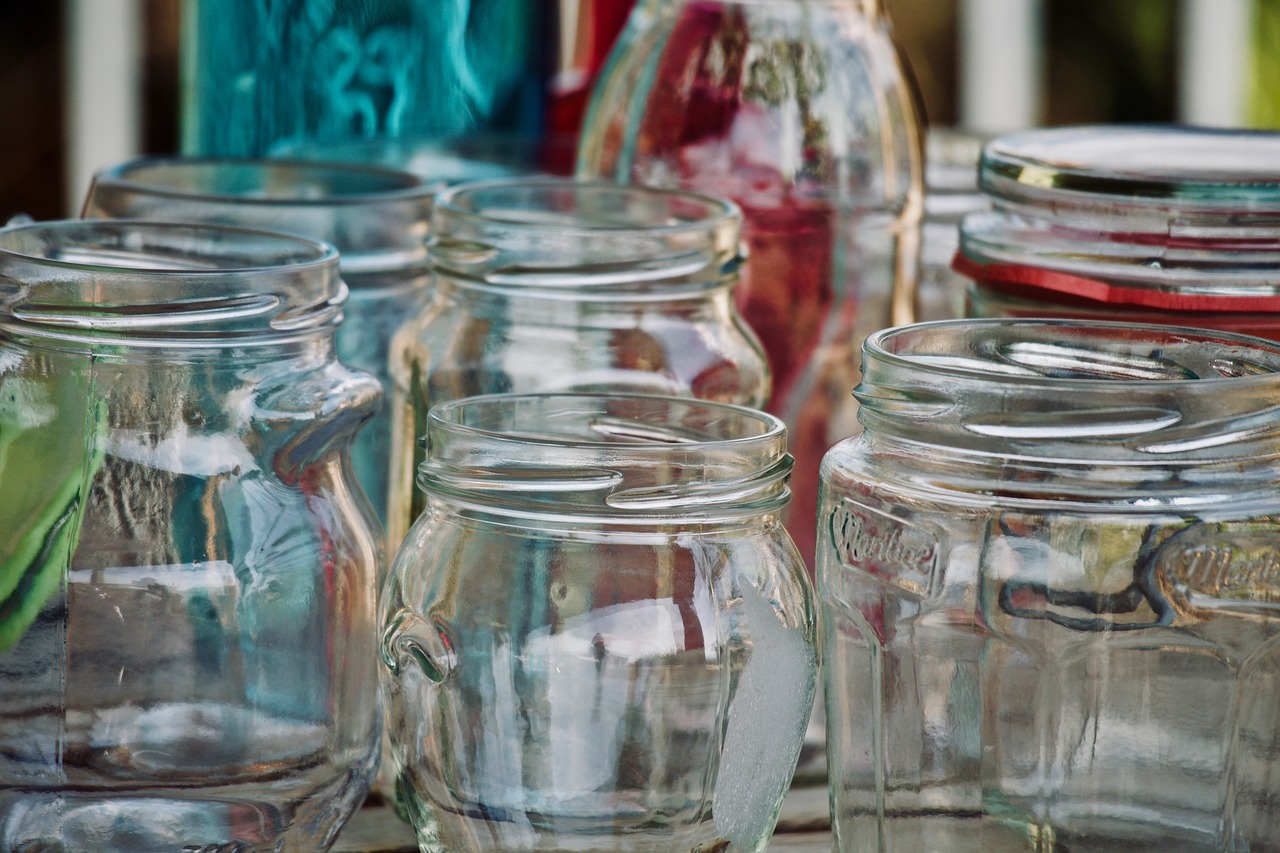 cleaned glass jars placed on the table